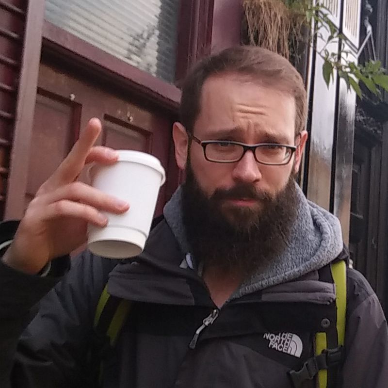 Picture of Markus holding a coffee to go in Dublin
